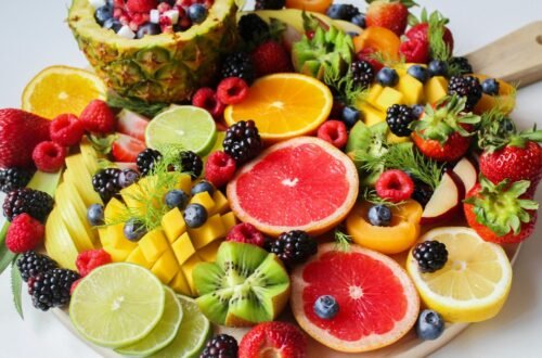 A vibrant assortment of fresh fruits beautifully arranged on a platter, perfect for a healthy and delicious snack.