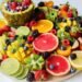 A vibrant assortment of fresh fruits beautifully arranged on a platter, perfect for a healthy and delicious snack.