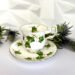A beautifully designed teacup with an ivy motif, complemented by thistle flowers, ideal for afternoon tea settings.